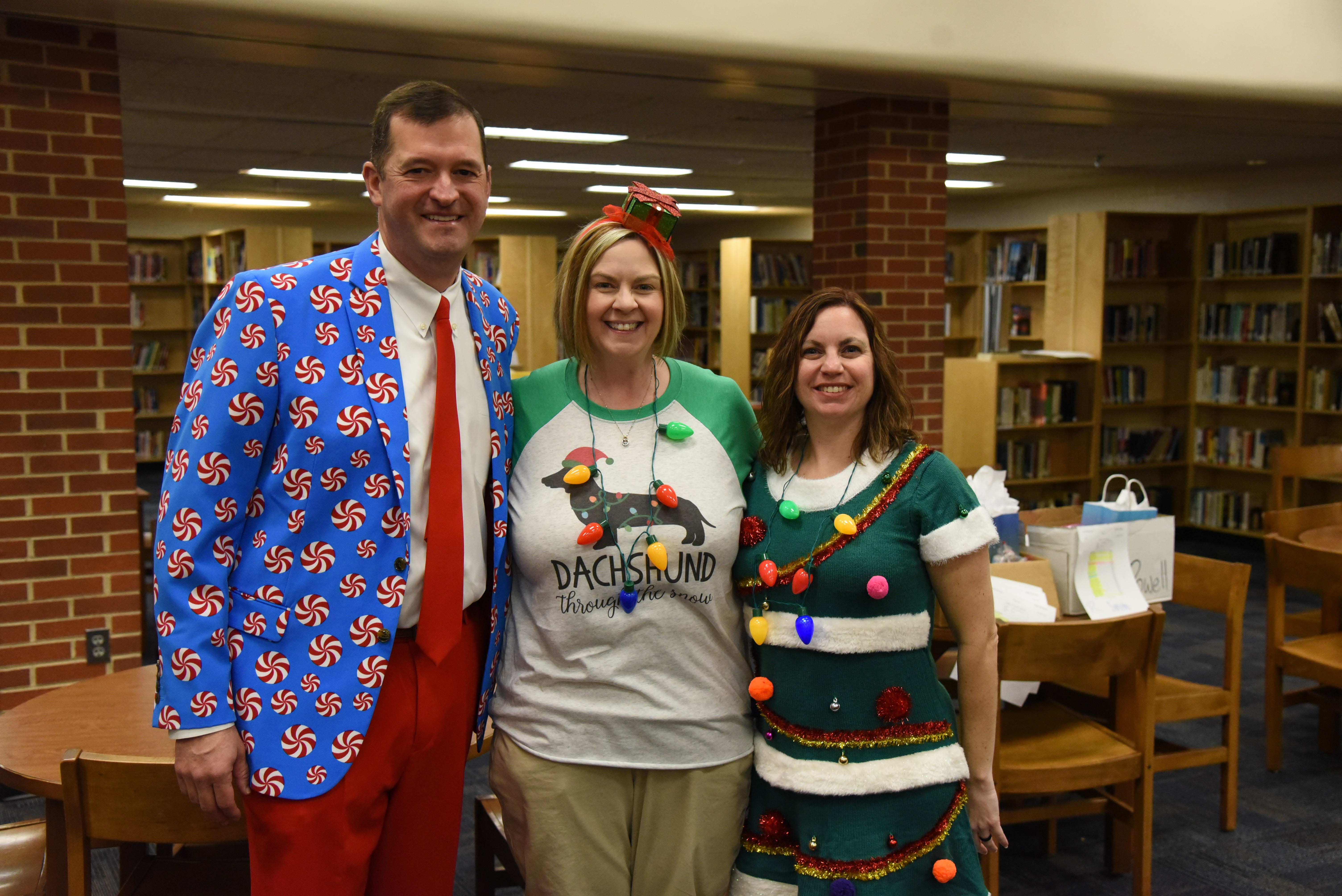The Renaissance Program, at Powell High School, supports activities such as Winter Wishes, which provides a holiday gift to every student. In 2019, principal Chad Smith, assistant principal Julie Liford, and teacher Beth Mooney took a moment to celebrate a successful Winter Wishes celebration. The Renaissance Program, at Powell High School, supports activities such as Winter Wishes, which provides a holiday gift to every student. In 2019, principal Chad Smith, assistant principal Julie Liford, and teacher Beth Mooney took a moment to celebrate a successful Winter Wishes celebration.